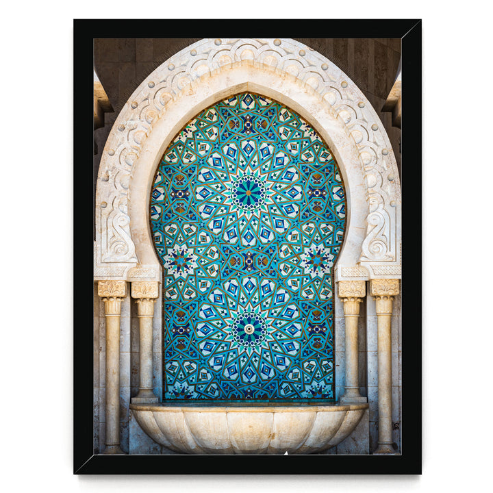 a large, ornate archway with intricate blue and white tile patterns. The archway is framed by two columns, and the overall design is visually striking and detailed.