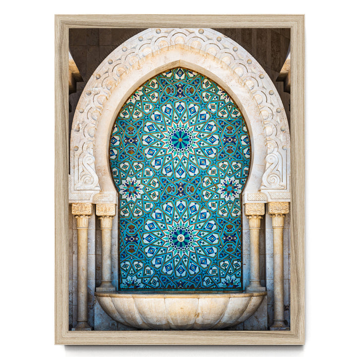 a beautifully crafted mosaic tile wall with intricate patterns and designs in shades of blue and white. The wall is framed by a white archway, adding to the overall aesthetic appeal of the scene.