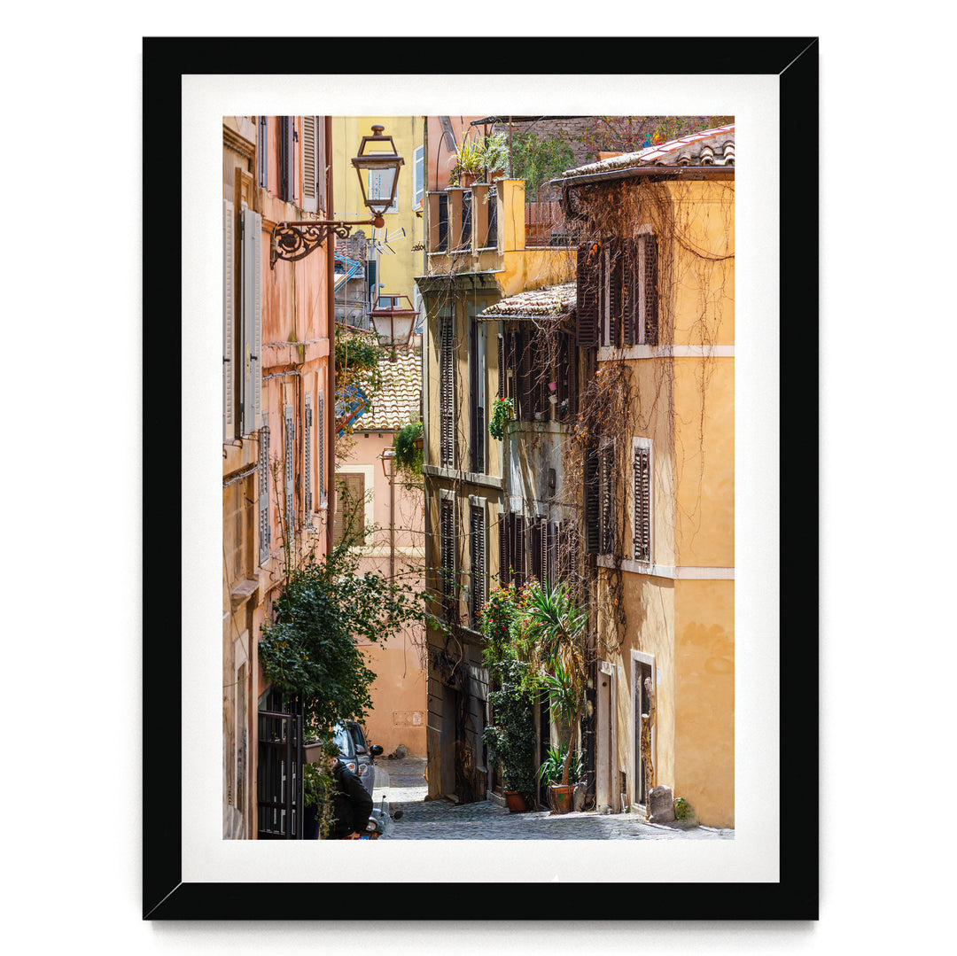 a narrow, charming street lined with colorful buildings, lush greenery, and a variety of potted plants.