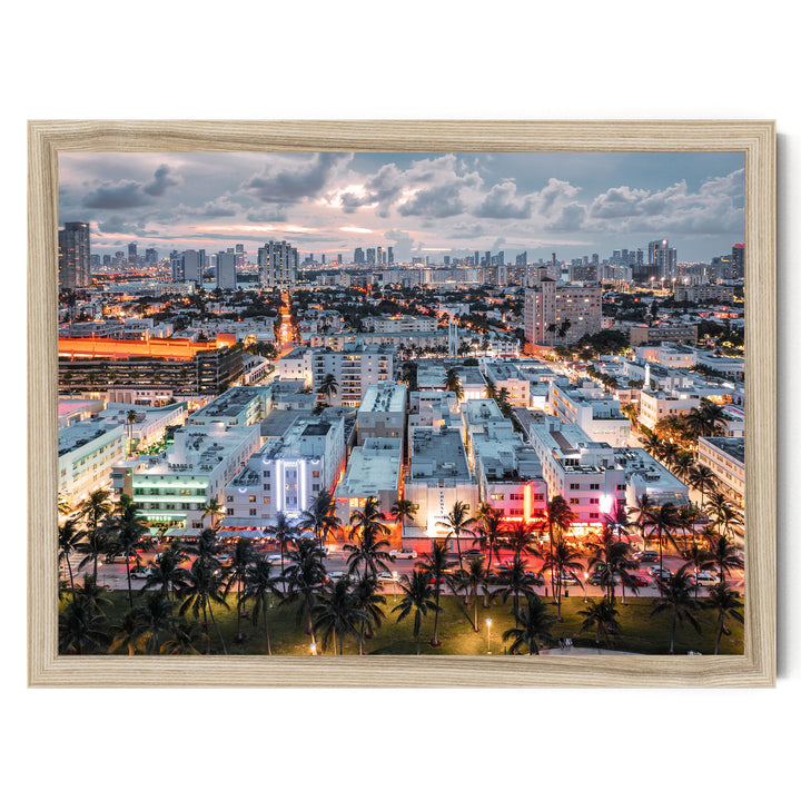 a vibrant cityscape at night, with a skyline of tall buildings illuminated by colorful lights. Palm trees line the streets, adding a tropical touch to the urban landscape.