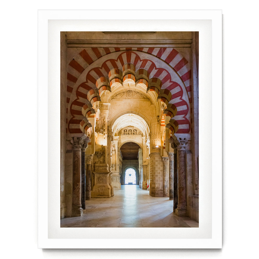 a grand, ornate hallway with arched doorways and columns, creating an impressive architectural space.
