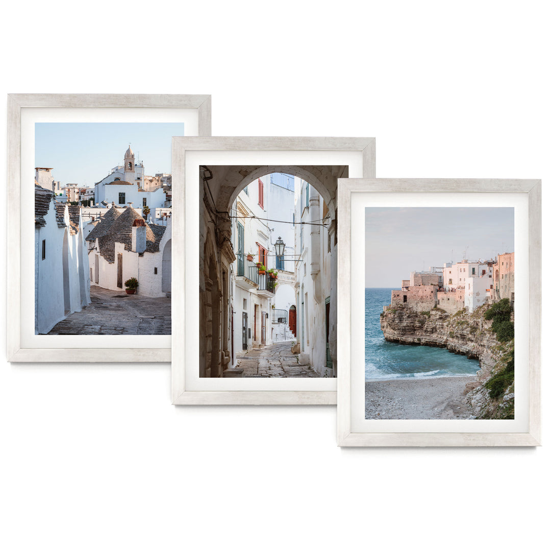 The image is a collage of three framed pictures, each depicting different scenes of a coastal town. The first picture shows a narrow street lined with white buildings, the second picture features a street with a large archway, and the third picture captures a beach with a rocky cliff overlooking the ocean.