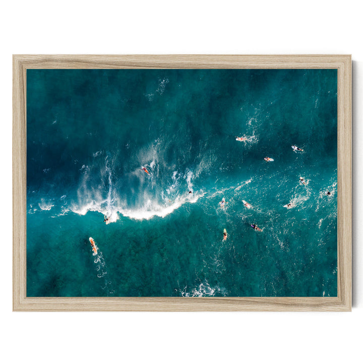 a group of people surfing in the ocean, with waves crashing around them.