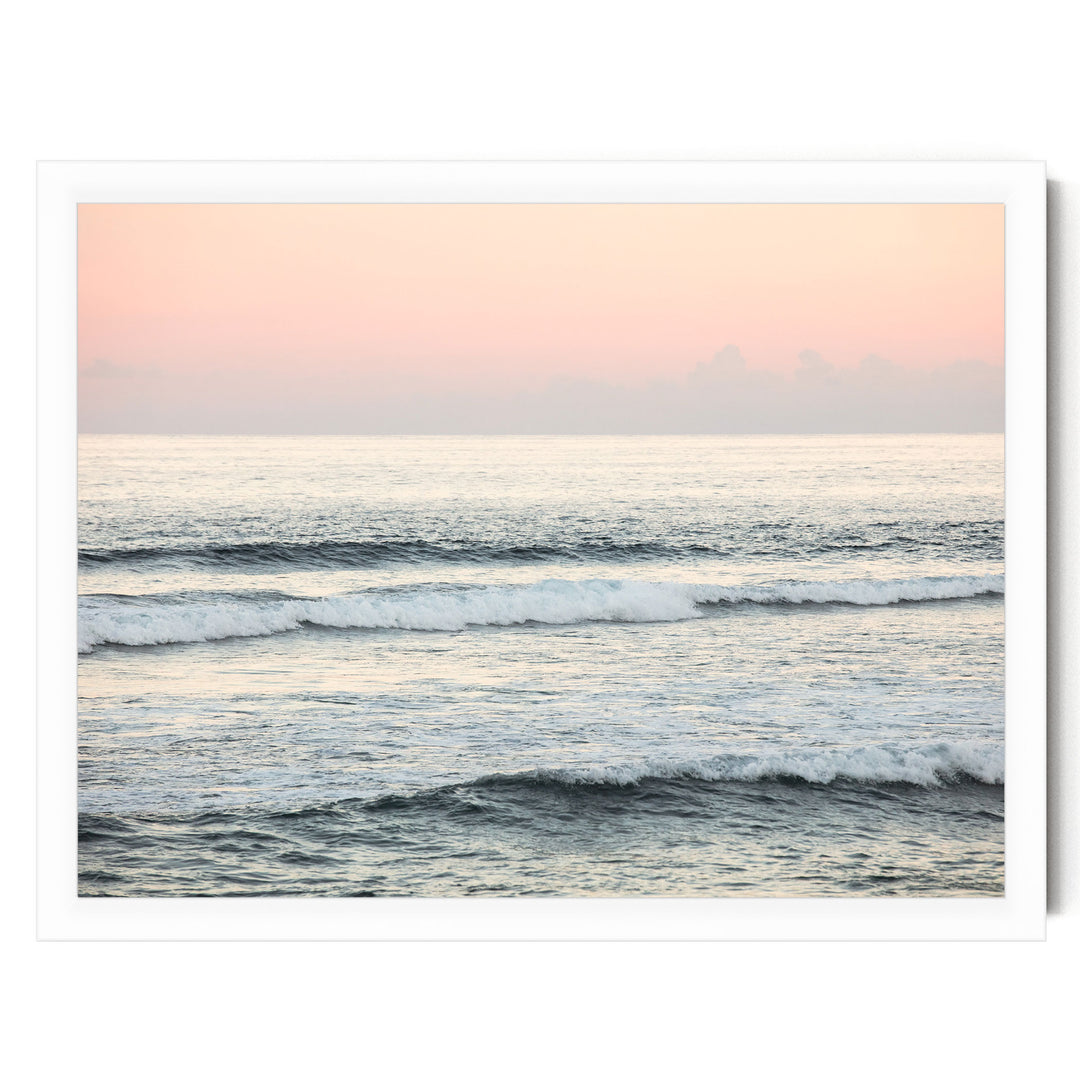 a serene ocean scene with waves gently rolling onto the shore, creating a tranquil atmosphere.