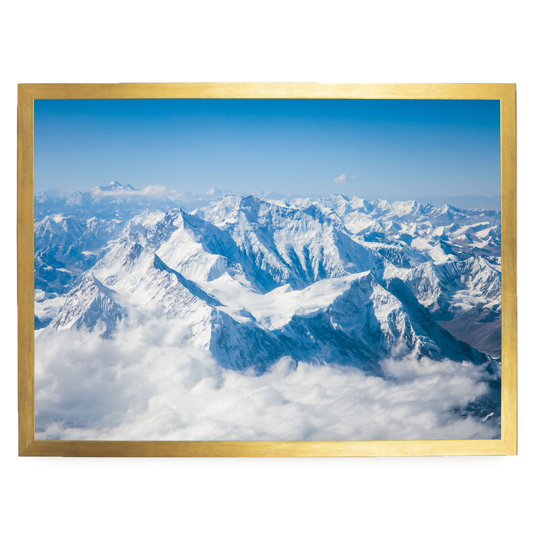 a breathtaking view of snow-capped mountains rising majestically from a sea of clouds, creating a stunning natural landscape.