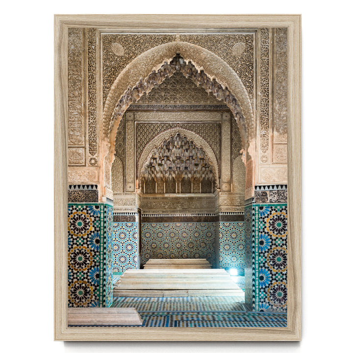 an ornate, intricately decorated interior space with a large archway and a tiled floor.