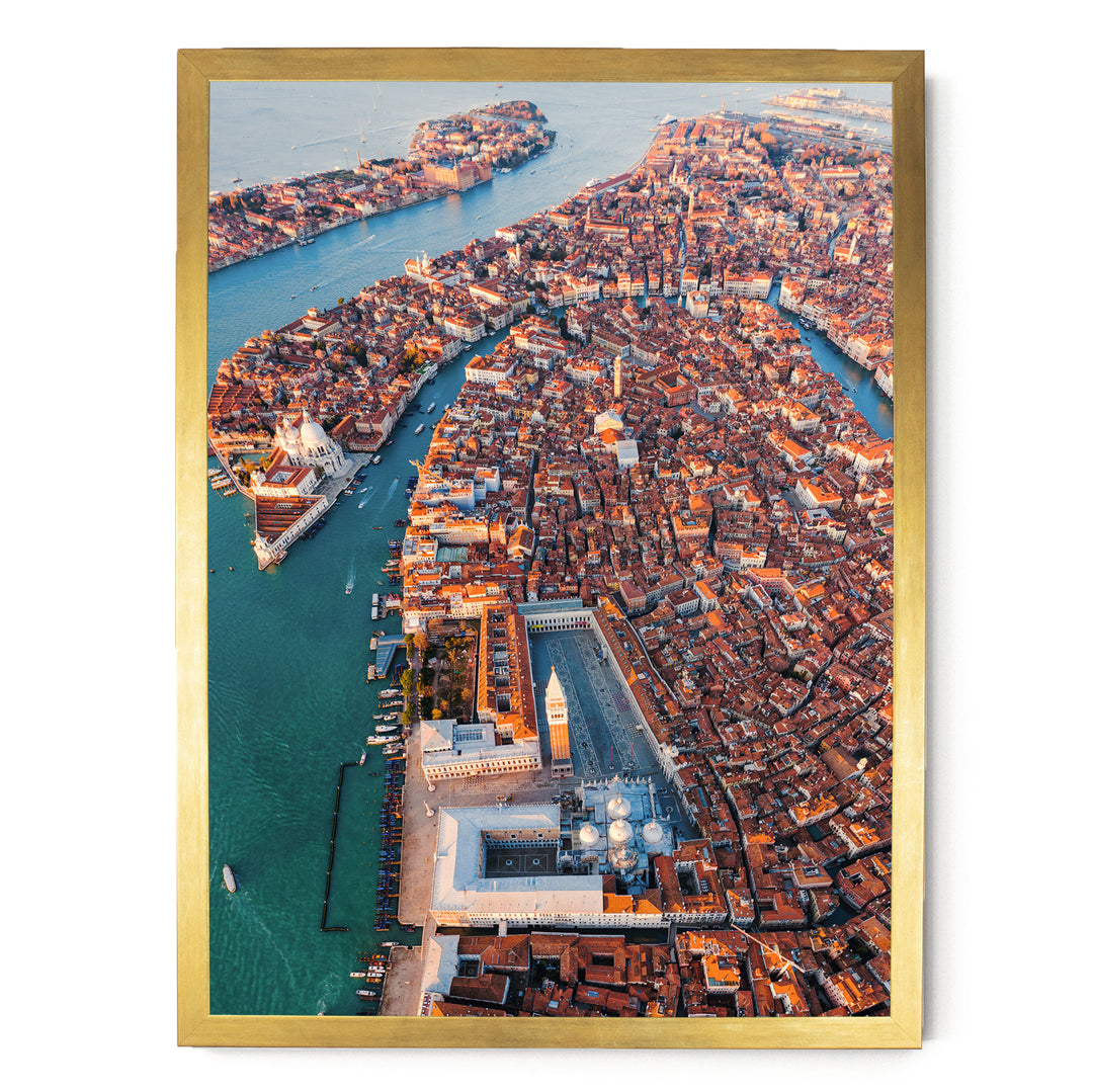 The image is an aerial view of a densely populated city with a river running through it. The city is filled with buildings and structures, creating a vibrant and bustling urban landscape.