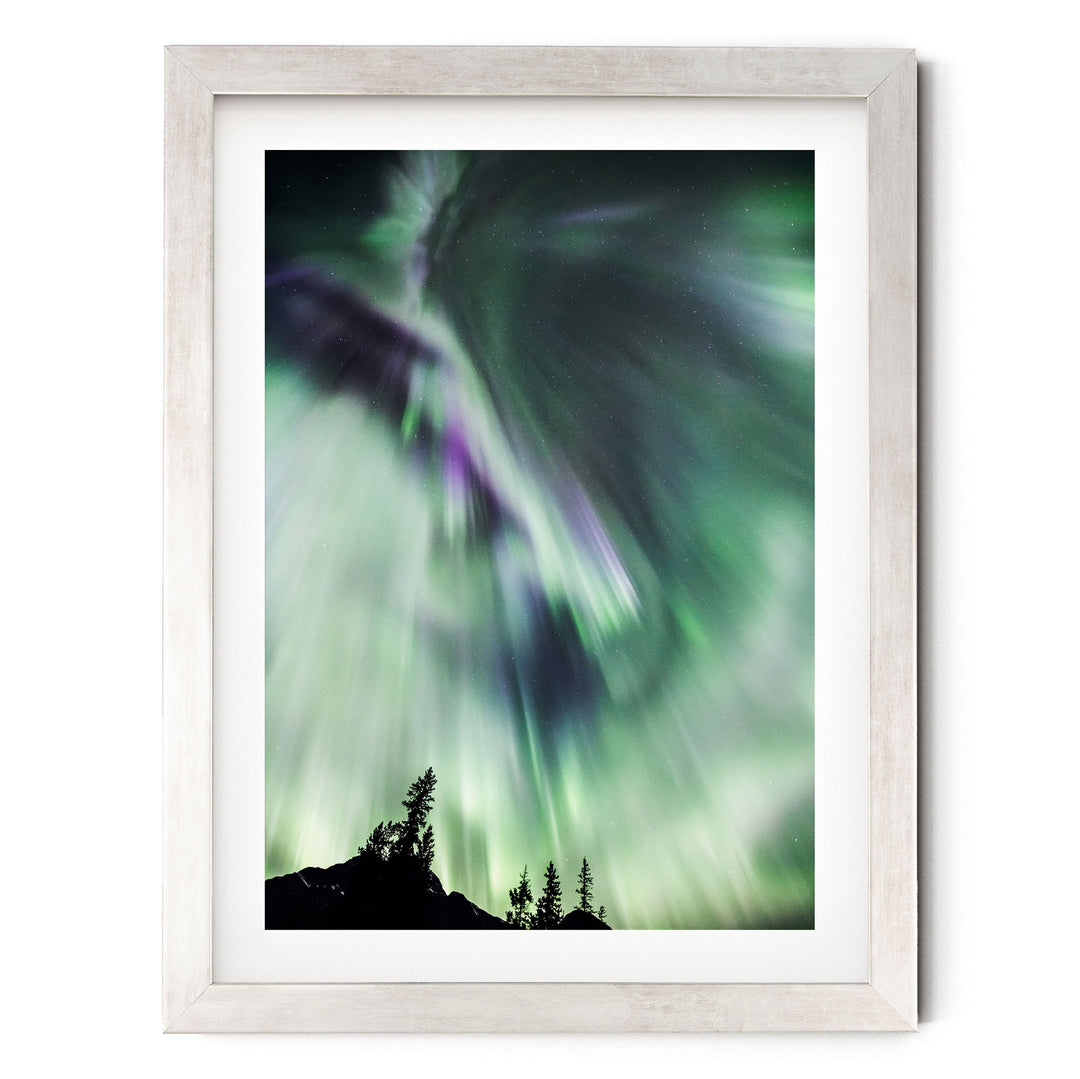 a stunning display of the northern lights, also known as the aurora borealis, illuminating the night sky with vibrant green and purple hues.