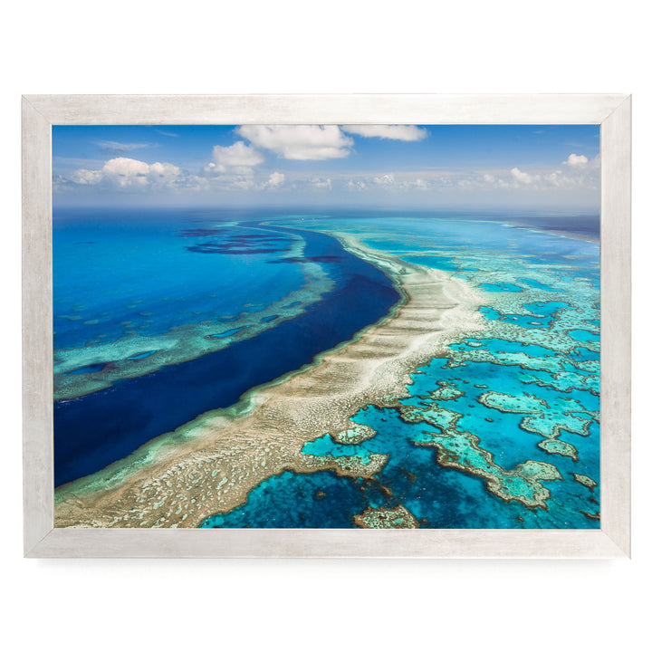 a stunning aerial view of a vibrant coral reef, showcasing the intricate and diverse ecosystem beneath the ocean's surface.
