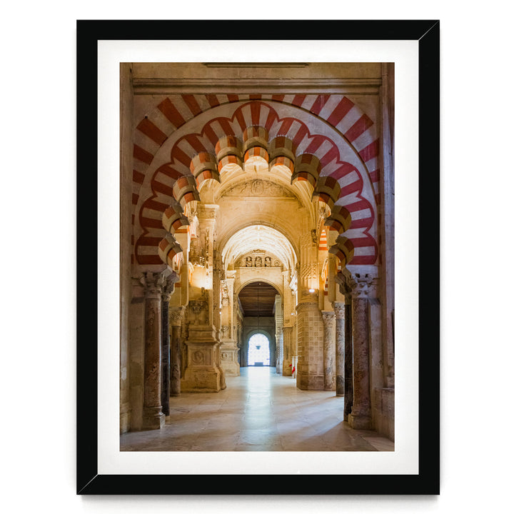 a long, ornate hallway with arched doorways and columns, creating a sense of depth and grandeur.
