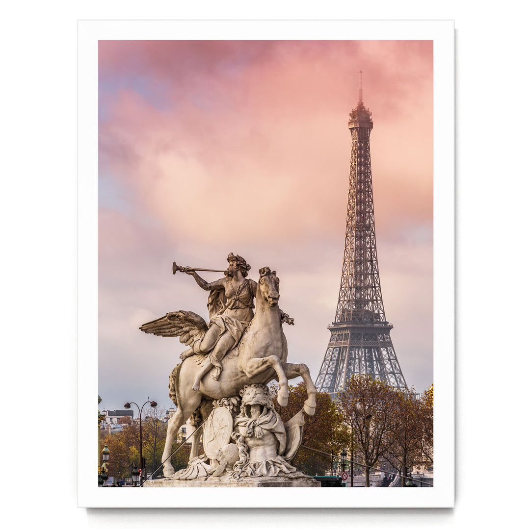 a large stone statue of a winged man riding a horse, with the Eiffel Tower visible in the background against a pink and purple sky.