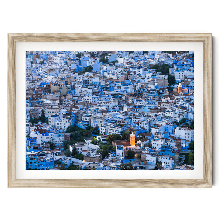 The image is a densely packed cityscape with numerous buildings in shades of blue and white, creating a visually striking and vibrant urban landscape.
