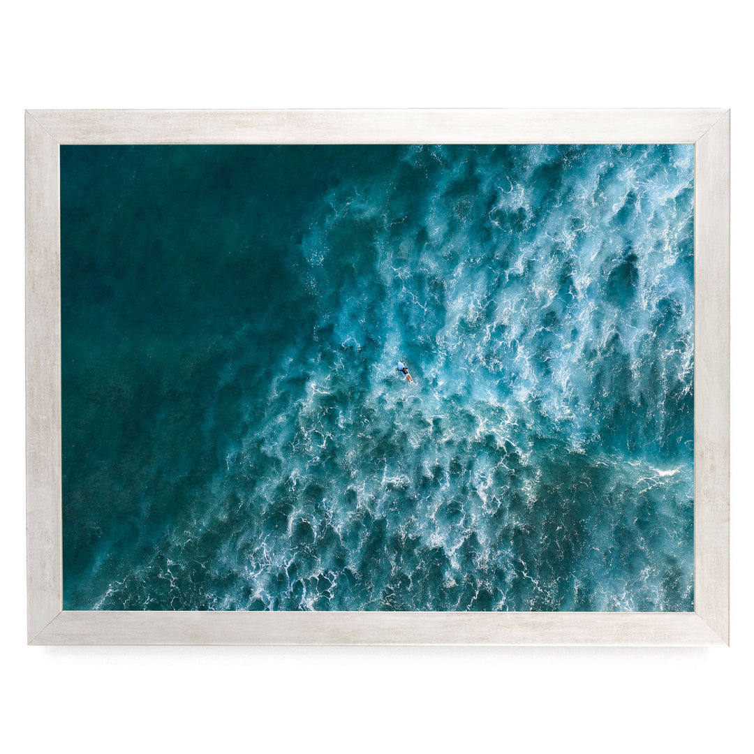 a surfer riding a large, powerful wave in the ocean.