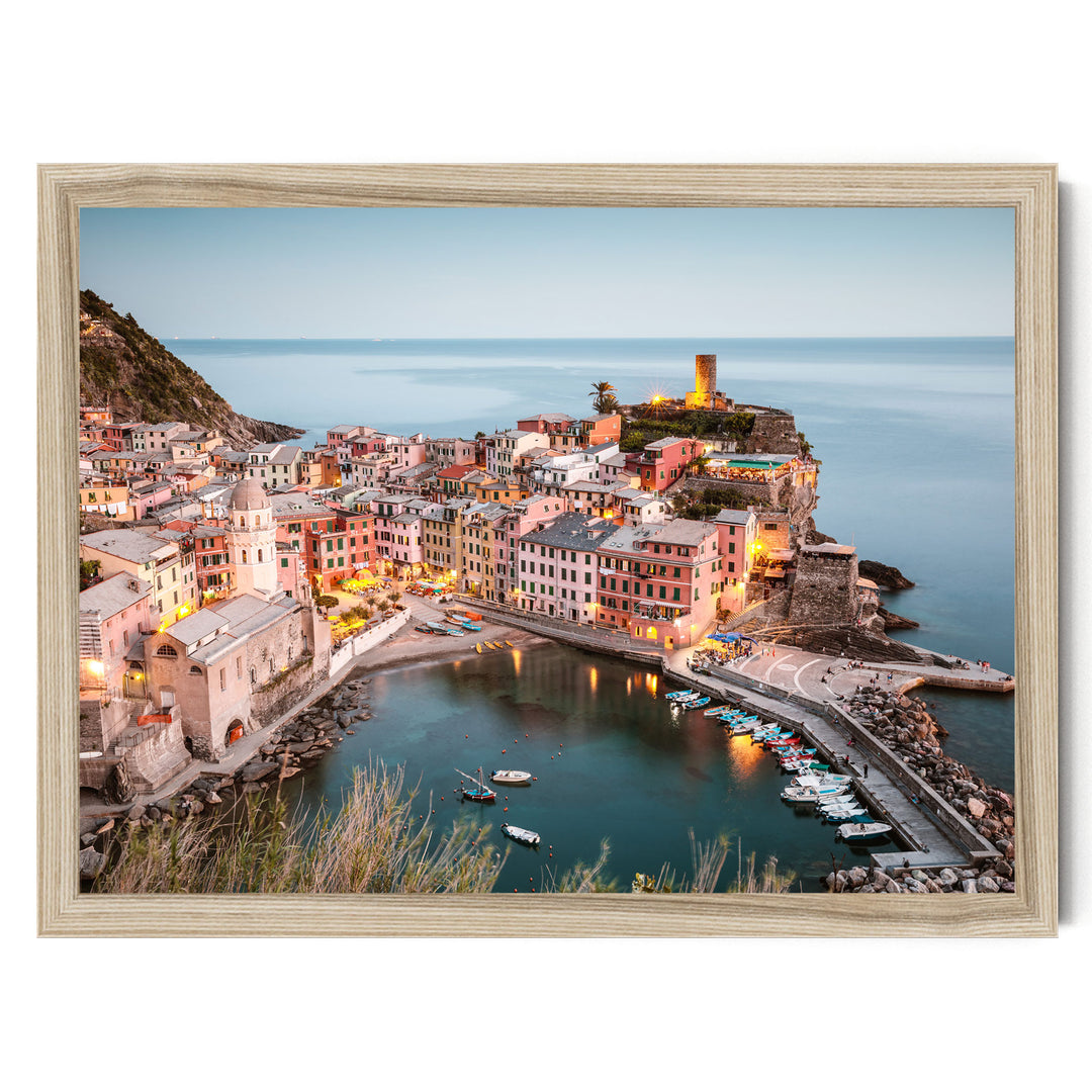 a picturesque coastal town with colorful buildings, a lighthouse on a cliff, and a harbor filled with boats.