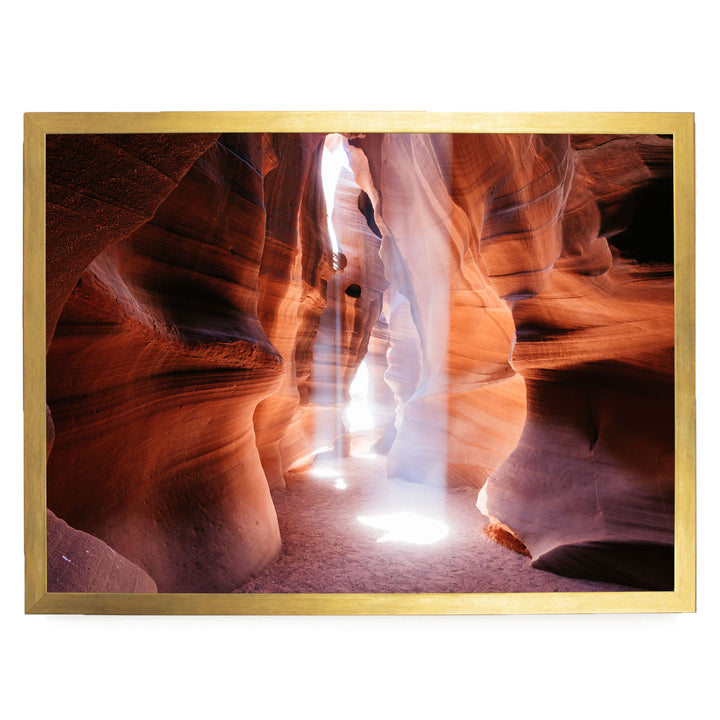 a narrow passage between two walls of a canyon, with sunlight streaming through the narrow opening and creating a dramatic, ethereal atmosphere.