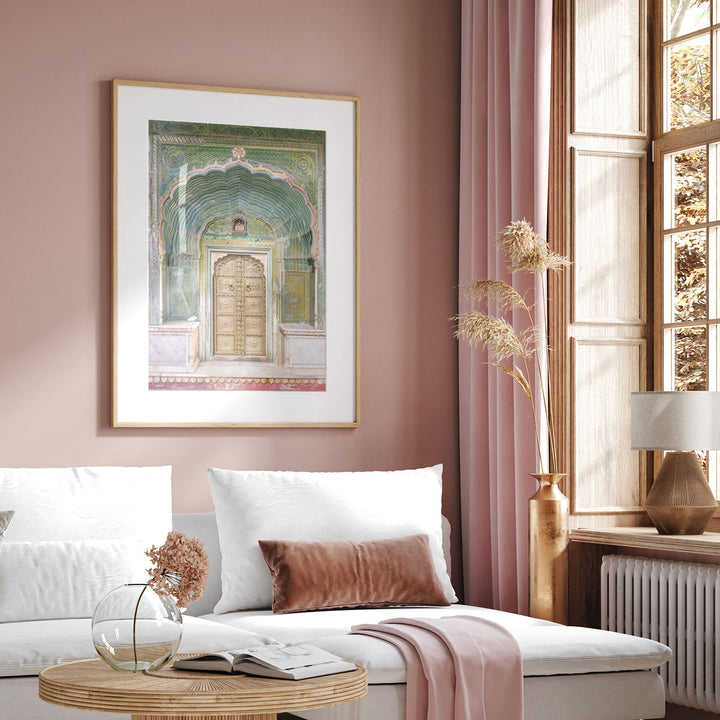 a living room with pink walls and a white couch