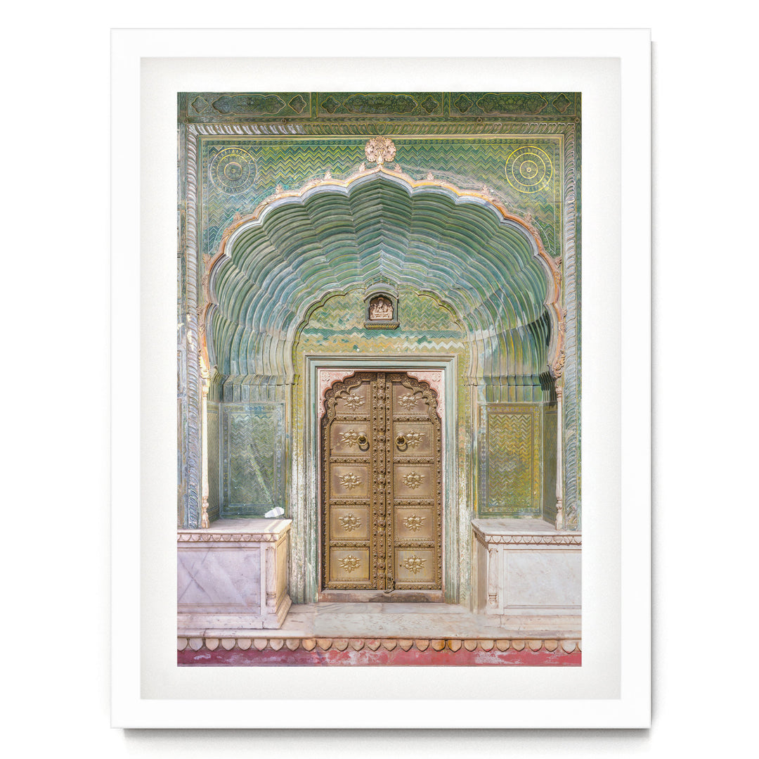 a large, ornate wooden door with intricate carvings and a colorful, patterned archway above it.