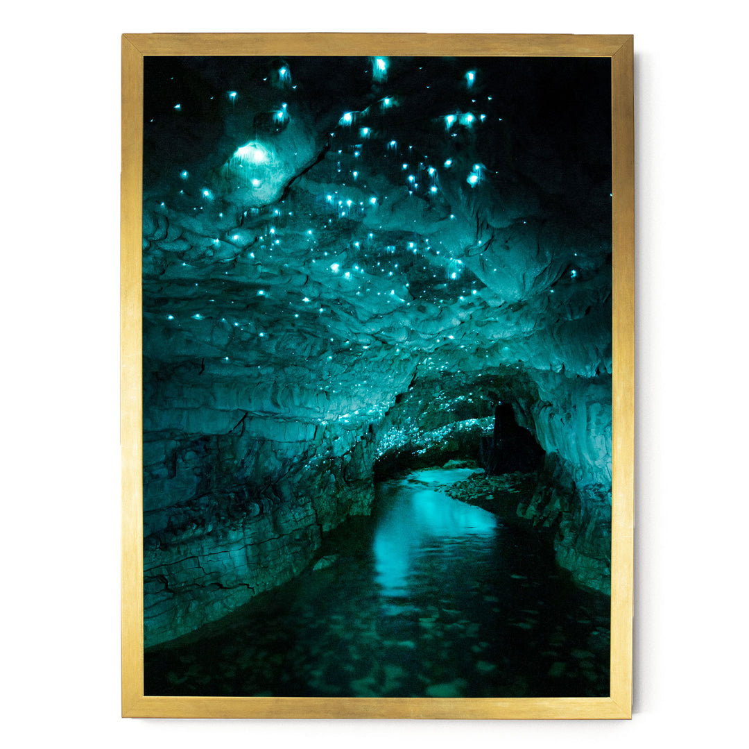 a cave with a stream of water flowing through it, creating a serene and tranquil atmosphere. The cave is illuminated by a mesmerizing glow of blue and green lights, which appear to be coming from the ceiling or the walls, creating a captivating and otherworldly ambiance.