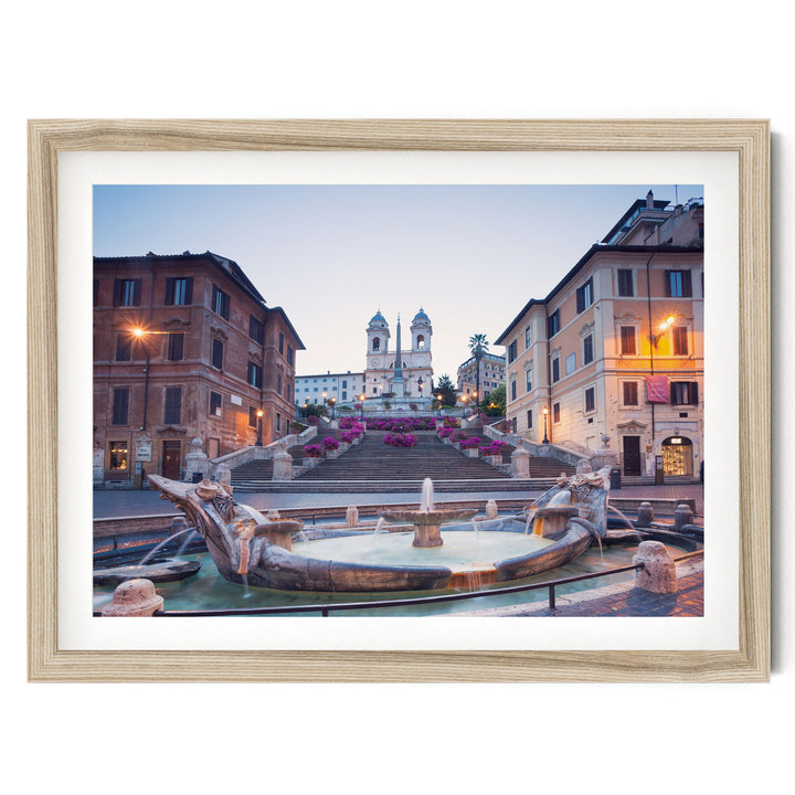 a picturesque scene of a fountain surrounded by ornate buildings, with a church steeple visible in the background.