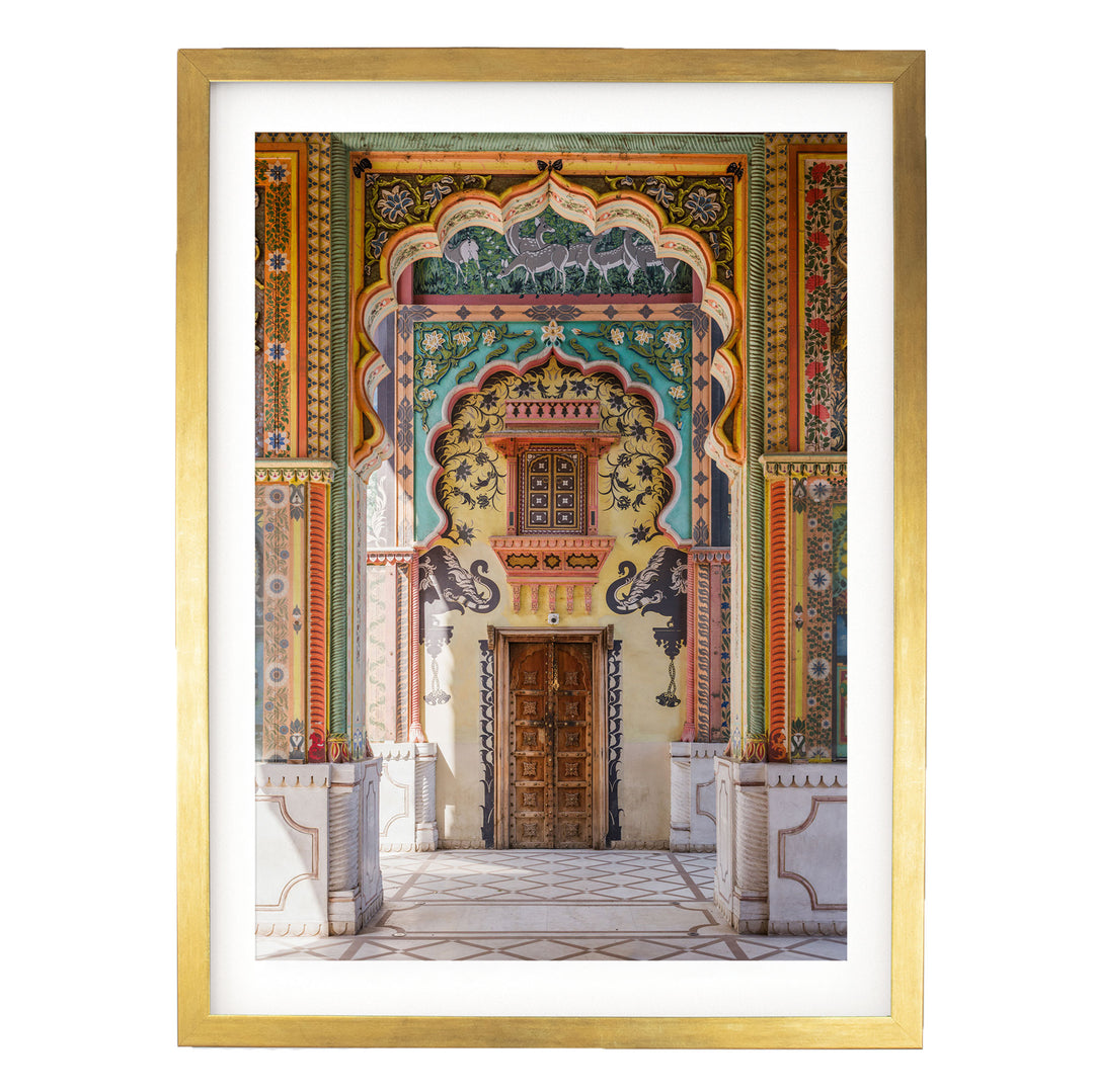 a colorful and ornate doorway with intricate patterns and designs, including arches, columns, and a wooden door.