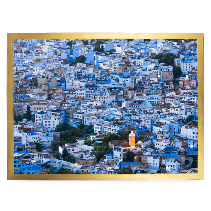 a densely packed cityscape with numerous buildings painted in shades of blue and white, creating a visually striking and vibrant urban landscape.
