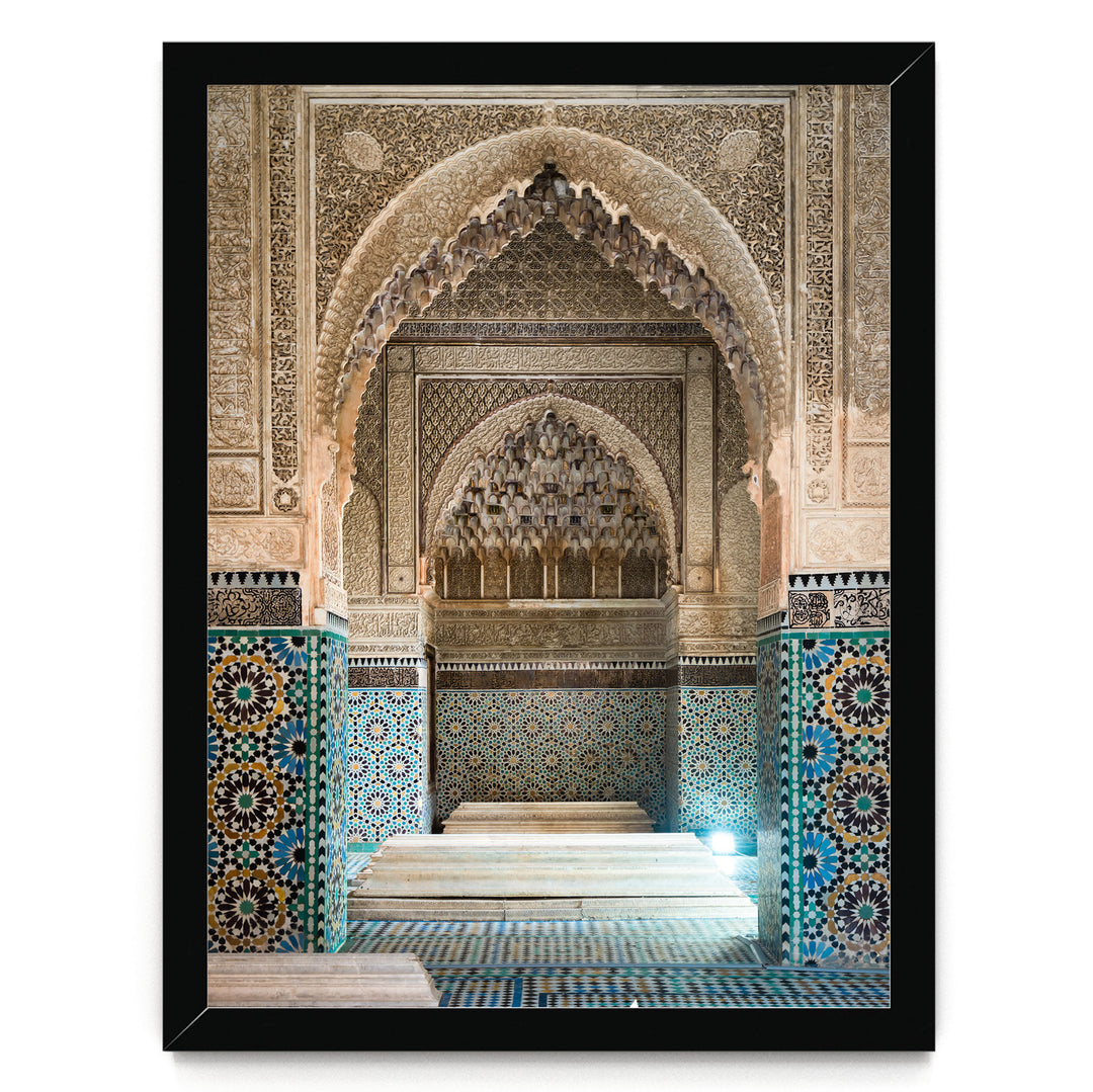 an ornate, intricately decorated interior space with a large archway and a tiled floor.