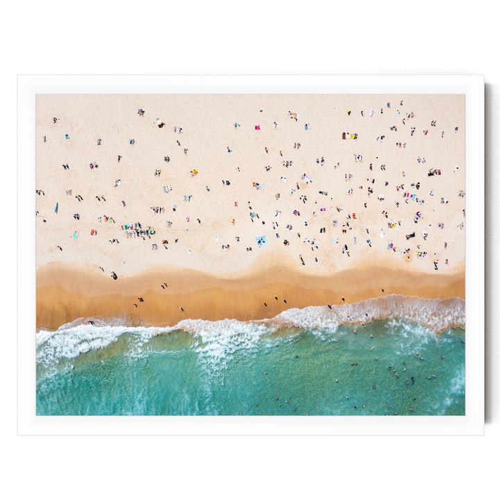 a crowded beach with many people enjoying the sun, sand, and water.