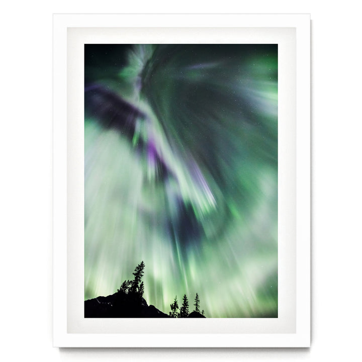 a stunning display of the northern lights, with vibrant green and purple hues swirling across the night sky.