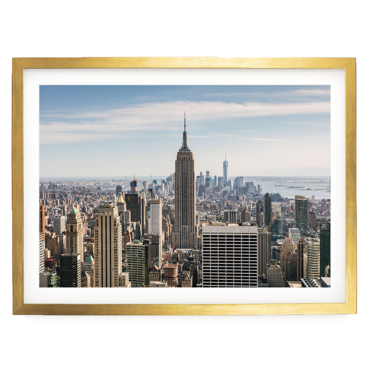 The image is a panoramic view of the New York City skyline, showcasing the iconic Empire State Building and other skyscrapers in the cityscape.