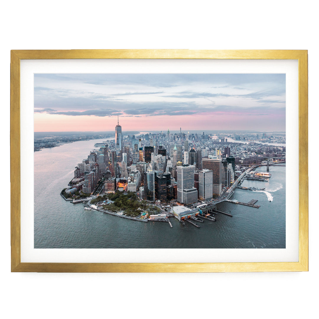 The image is a panoramic aerial view of the New York City skyline, showcasing the city's iconic skyscrapers and waterfront.
