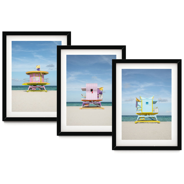 The image is a collage of three framed pictures, each depicting a lifeguard tower on a beach. The lifeguard towers are painted in various colors, including pink, yellow, and blue, and are situated on the sandy beach with the ocean in the background.