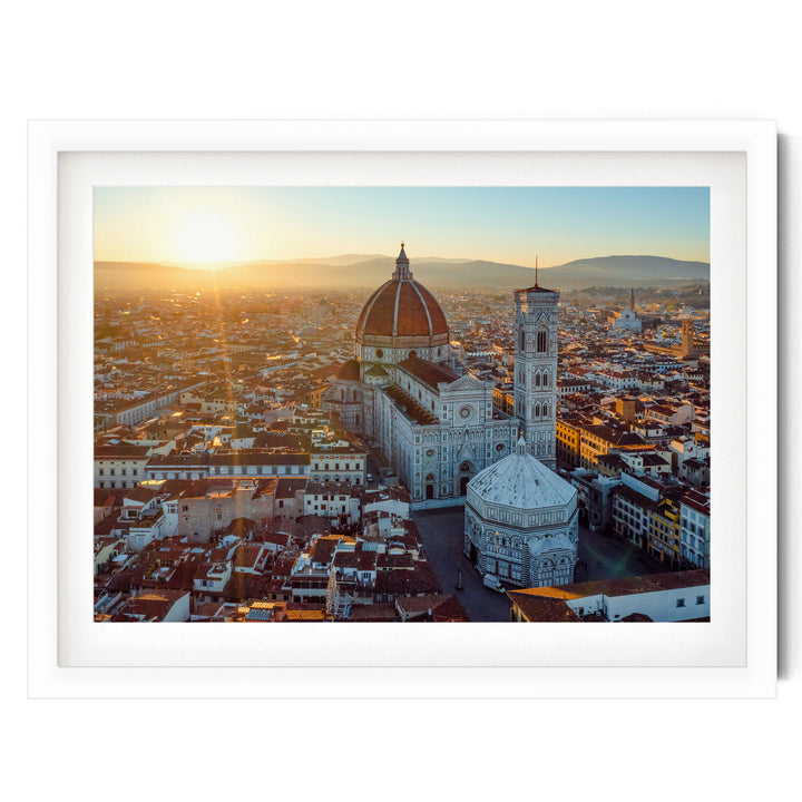 the iconic Florence Cathedral, also known as the Cathedral of Saint Mary of the Flower, standing tall in the heart of the city of Florence, Italy. The cathedral's distinctive dome and bell tower are clearly visible against the backdrop of the cityscape.