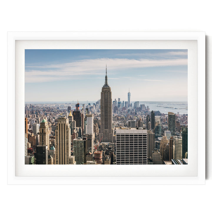 a panoramic view of the New York City skyline, with the iconic Empire State Building standing prominently in the center.
