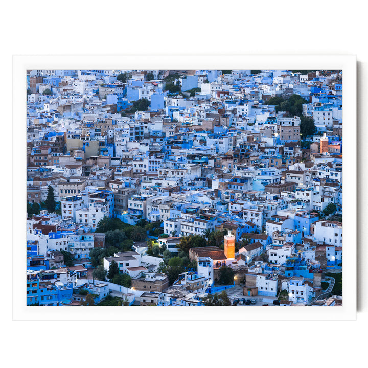 a densely packed cityscape with numerous buildings painted in shades of blue and white, creating a visually striking and vibrant urban landscape.