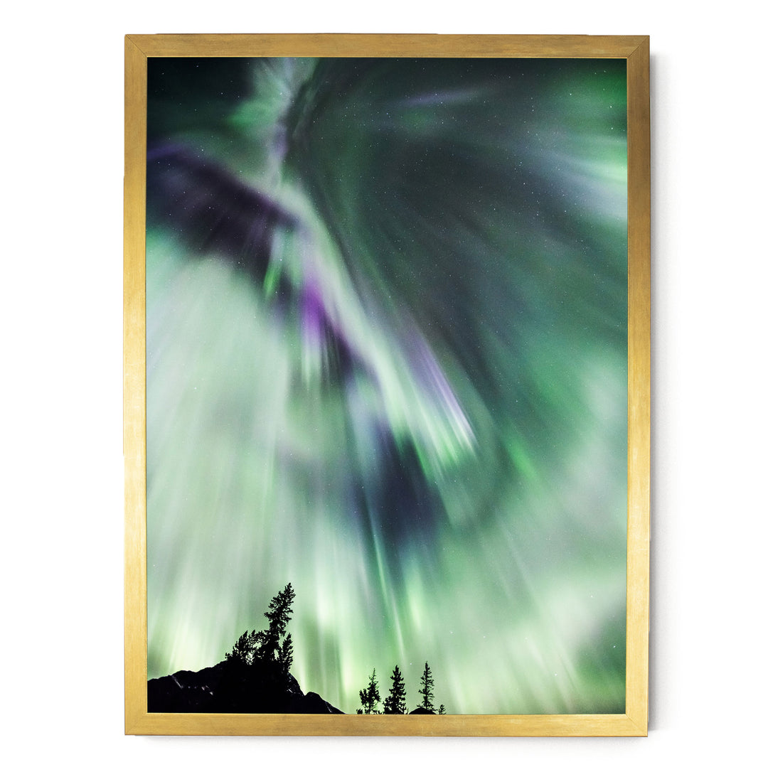 a stunning display of the Aurora Borealis, or Northern Lights, illuminating the night sky with vibrant green and purple hues.