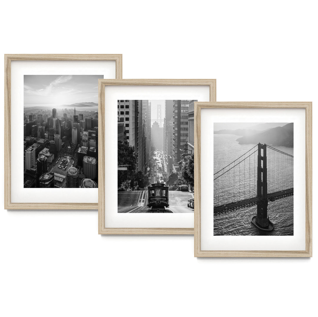 three framed photographs of the golden gate bridge