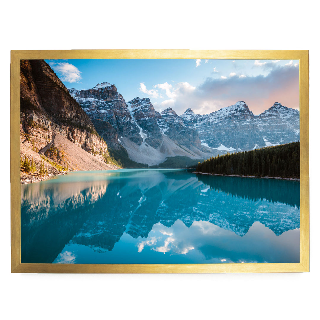 a serene mountain lake with a stunning reflection of the surrounding mountains and sky.