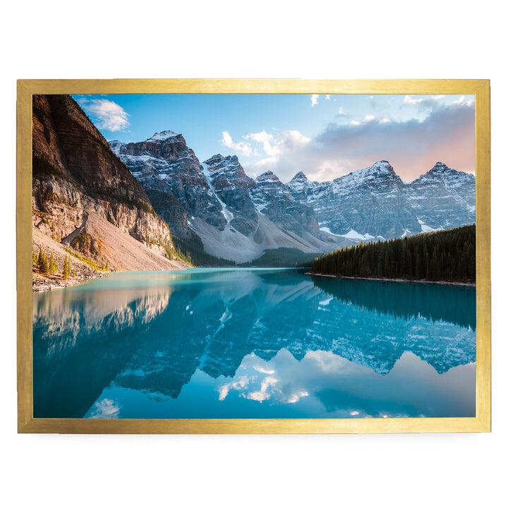 a serene mountain lake with a stunning reflection of the surrounding mountains and sky.