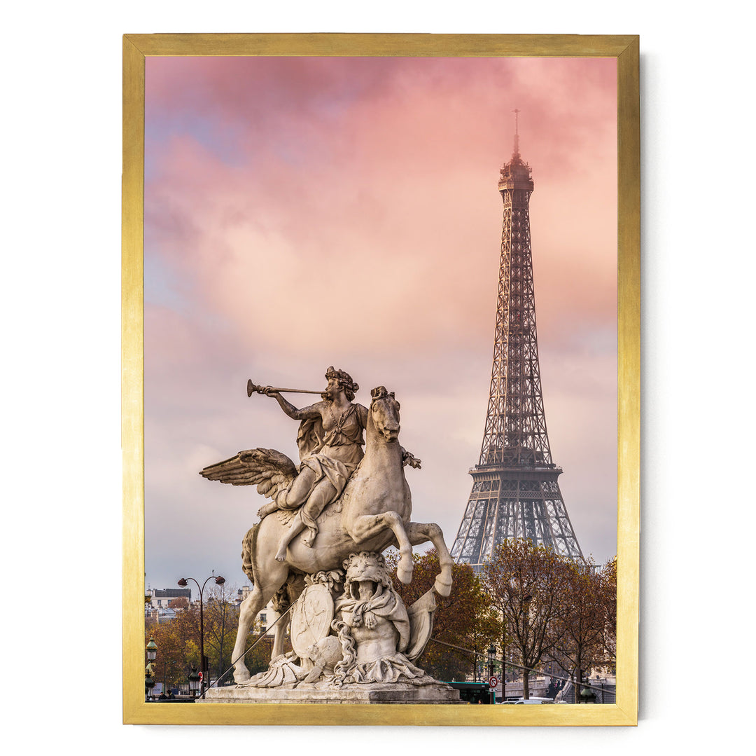 a statue of a winged man riding a rearing horse, with the Eiffel Tower visible in the background.
