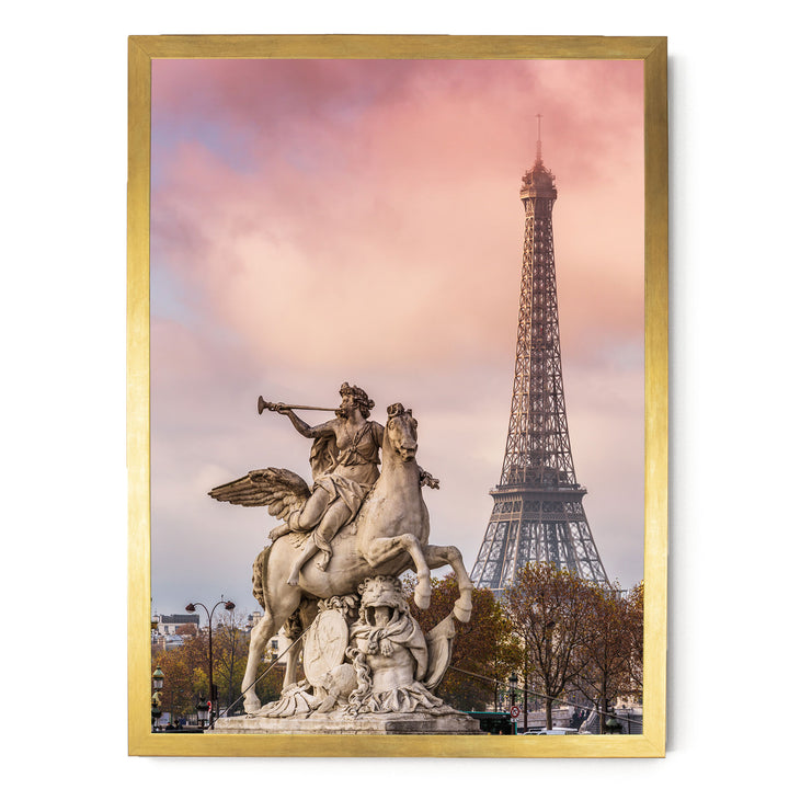a statue of a winged man riding a rearing horse, with the Eiffel Tower visible in the background.