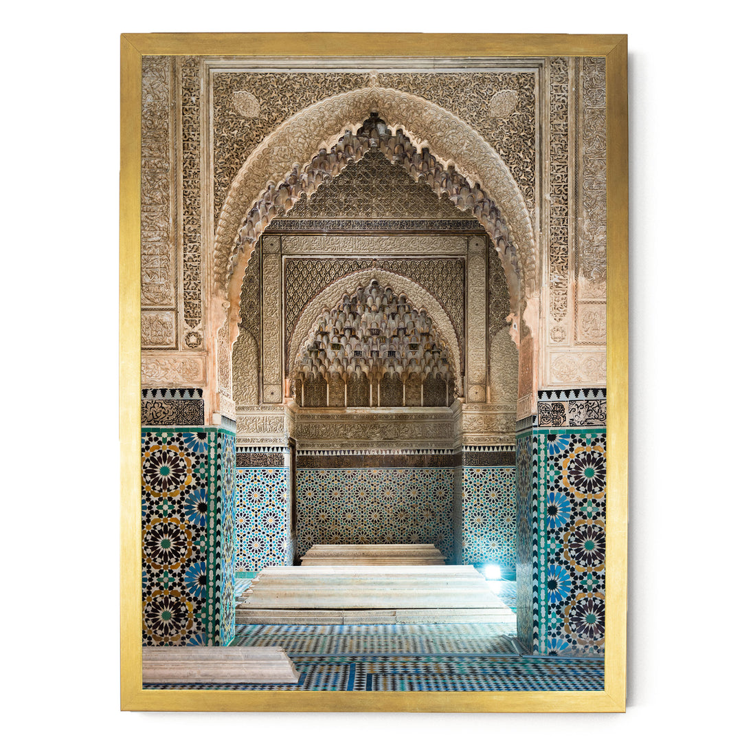 an ornate, intricately decorated interior space with a large archway, tiled walls, and a central platform.