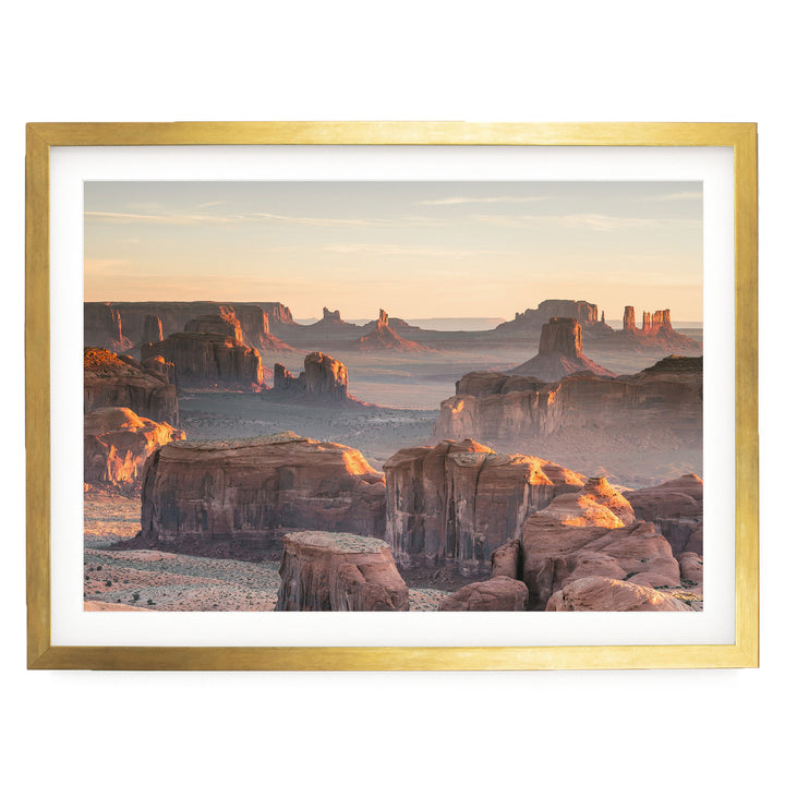 a breathtaking view of the Grand Canyon, with its vast, rugged landscape and towering rock formations bathed in the warm glow of the setting sun.