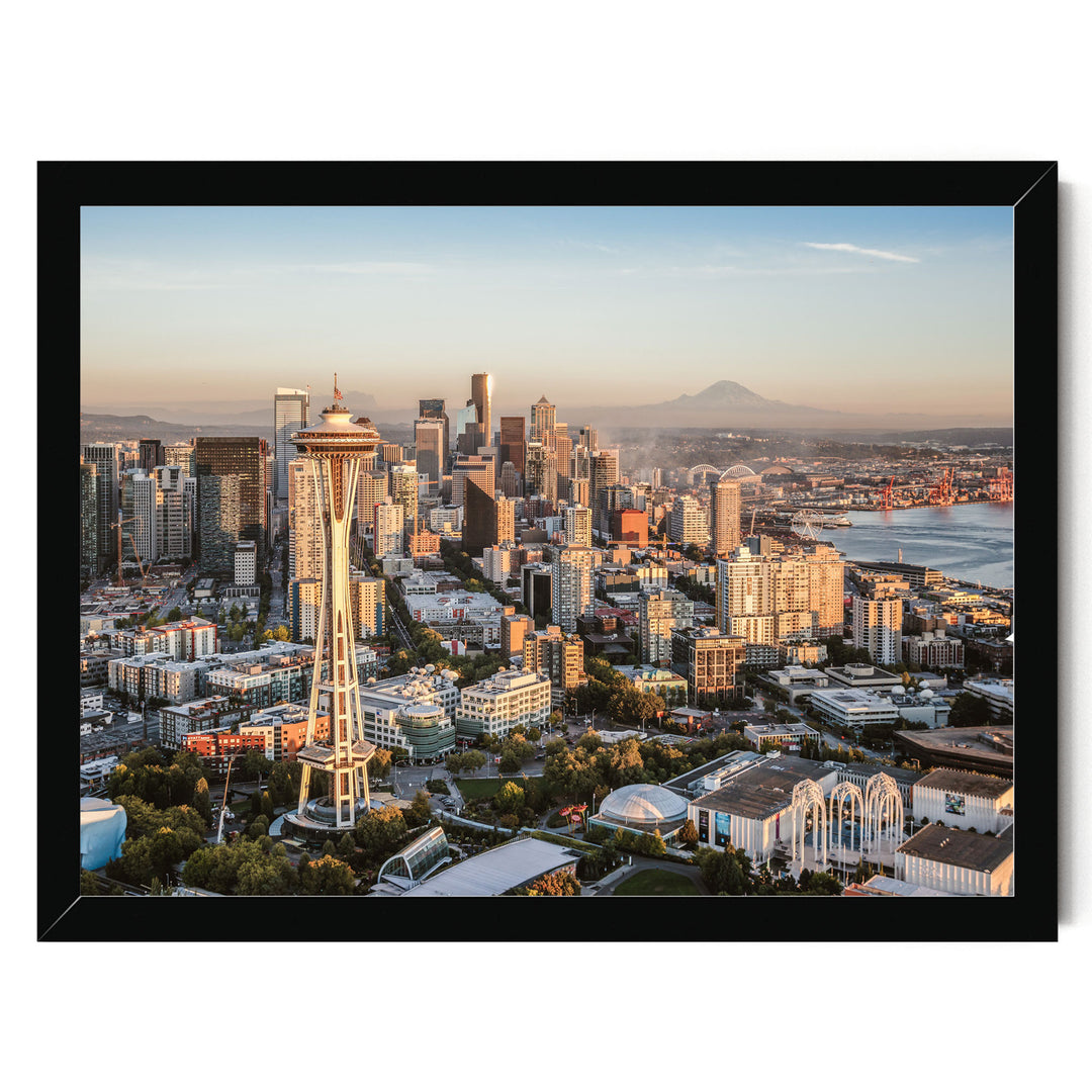 a panoramic view of the Seattle skyline, featuring the iconic Space Needle and other high-rise buildings.