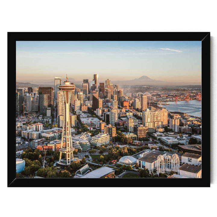 a panoramic view of the Seattle skyline, featuring the iconic Space Needle and other high-rise buildings.