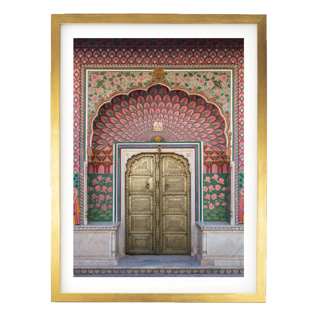 a large, ornate golden door with intricate designs and patterns, set within a colorful, decorative archway.