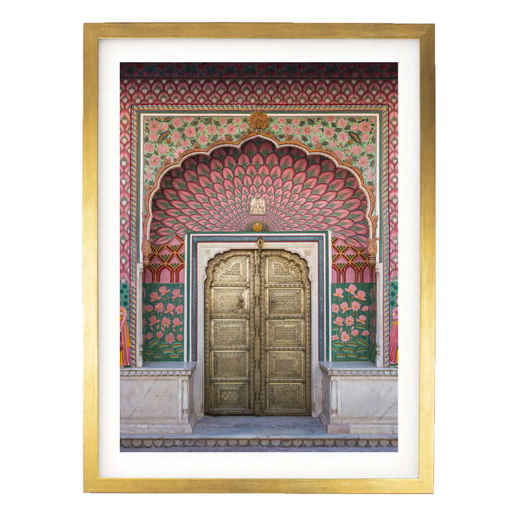 a large, ornate golden door with intricate designs and patterns, set within a colorful, decorative archway.