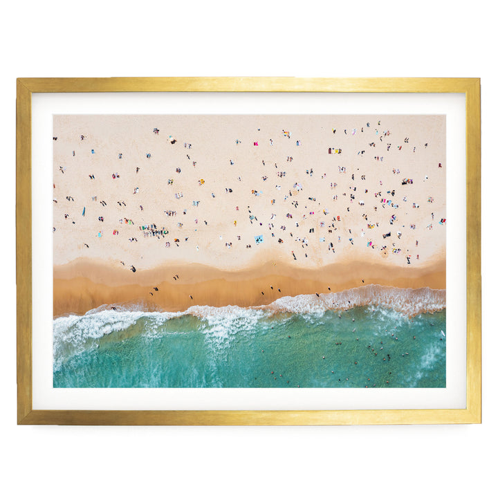a crowded beach with many people enjoying the sun, sand, and water.