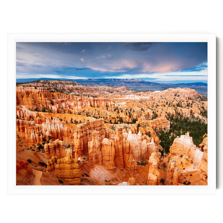 a breathtaking view of the Grand Canyon, showcasing its vast and rugged landscape with towering red rock formations and a dramatic cloudy sky.