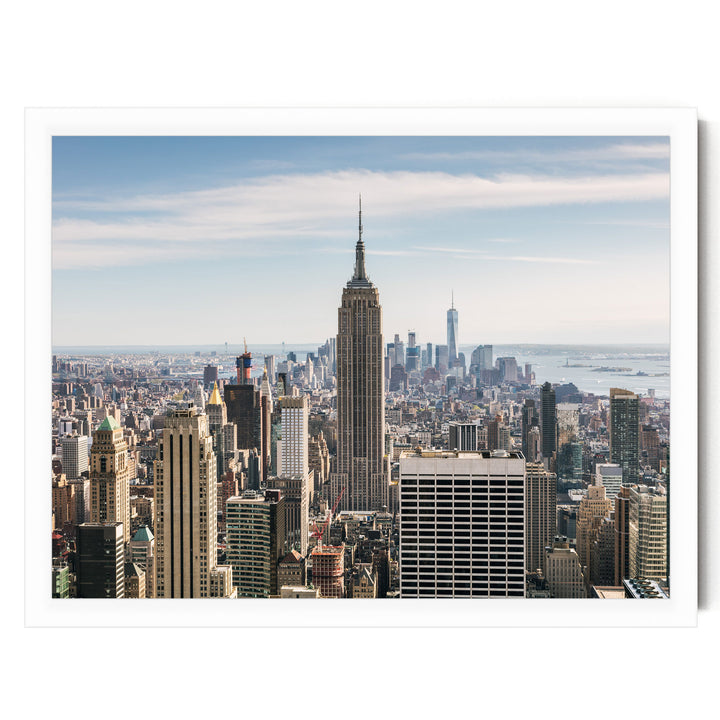 a panoramic view of the New York City skyline, featuring the iconic Empire State Building and other skyscrapers.