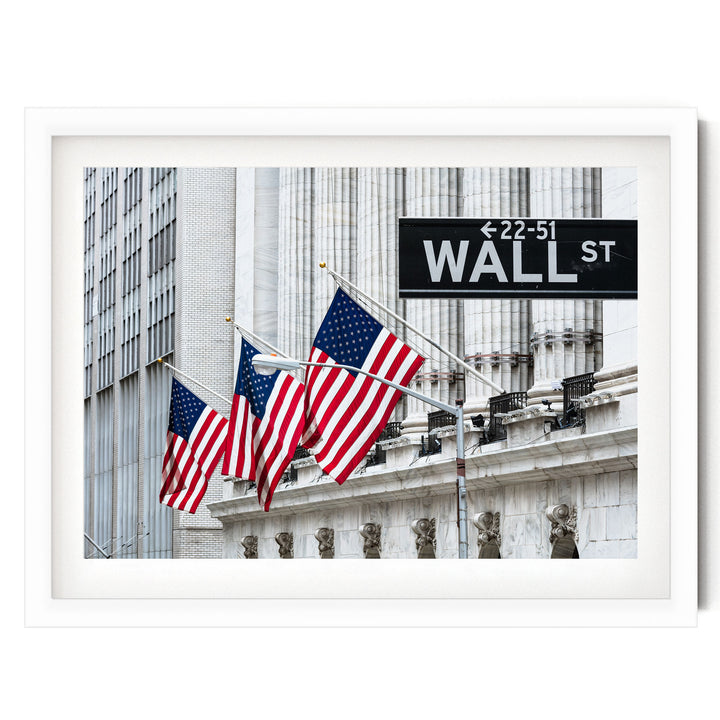 the iconic New York Stock Exchange building with three American flags flying in front of it, and a Wall Street sign indicating the direction to the 22nd Street Wall Street.